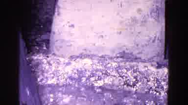 Trenton New Jersey (1967): An Object Being Repeatedly Dipped Into And Removed From