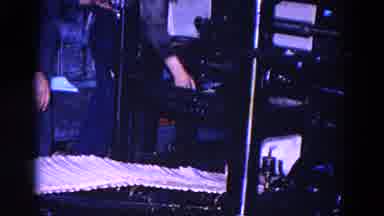 TRENTON NEW JERSEY-1967: Industrial Printing Press Conveyor Belt Works At Making