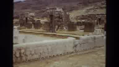 Iran (1972): View Of Tan And White Artwork And Stone Wall On A Clear Day