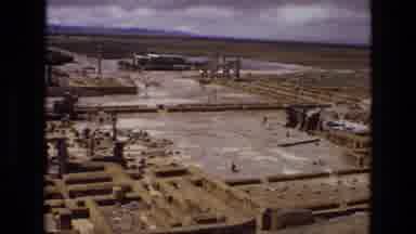 IRAN-1972: Aerial View Of Ruins In Desert With Brief Shot Of Standing Arch