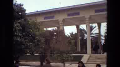 Iran (1972): People Walking On White Tiled Sidewalks In A Clear Day