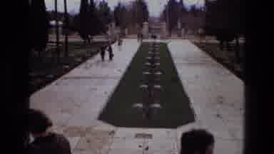 Iran (1972): People Gather Around The Building And Take In The Sights As They Pass