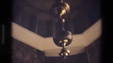 Iran (1972): Golden Thing Hanging From Ceiling Then A Man Looking At Some Writing