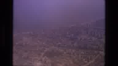 Iran (1972): A Polluted City From The Distance Followed By A Pair Of Women Walking
