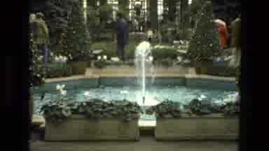 Iran (1972): A Water Fountain In A Public Area With People Walking Around