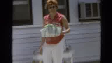Branson Missouri USA (1968): A Woman In A Dress Walks By Stops And Then A Dog Is