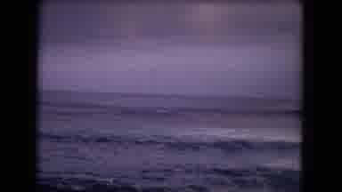 Honolulu Hawaii (1968): A Surfer On A Calm Day Starting To Ride Low Rolling Ocean