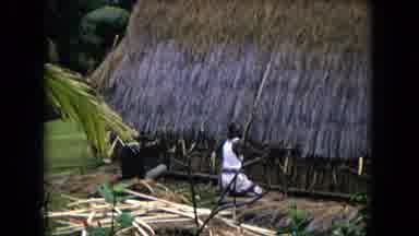 Honolulu Hawaii (1968): Two Native People Seated Playing Game Person Working On