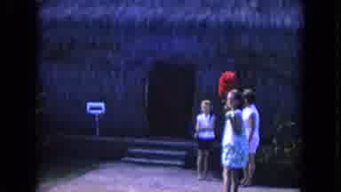 Honolulu Hawaii (1968): Tourists Look At Grass Huts And Watch People Dance The
