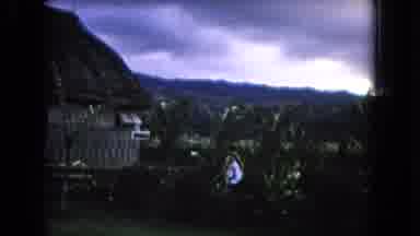 Honolulu Hawaii (1968): Two People Walking Into A Hut In A Tropical Region