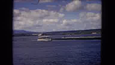 Honolulu Hawaii (1968): Ferry Transports People Across The Water To An Island Amid