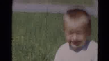 Lincoln Nebraska (1968): Boy Playing In The Garden Of His Residence Accompanied By