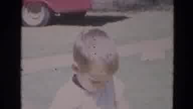 Lincoln Nebraska (1968): Little Boy Walks Towards The Camera While The Scene