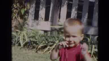 Lincoln Nebraska (1968): Baby Sitting In The Grass Shakes His Hands As If To Say
