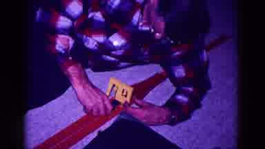 Minnesota USA (1968): Man Constructs A Toy Car Set And A Young Boy Plays With It