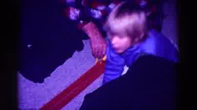 Minnesota USA (1968): Young Boy Playing With Toy Car Track With Elder Man