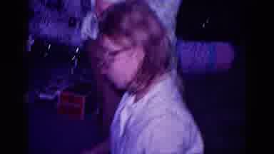 Minnesota USA (1968): Woman Bends Over To Get Christmas Presents And Wiggles Her