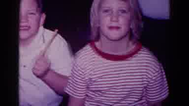 Minnesota USA (1968): Three Young Boys Wave To And Smile At The Camera