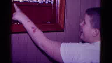Minnesota USA (1968): Child Excited To Point Out A Blue Antique Toy Car In A
