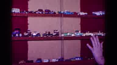 Minnesota USA (1968): Hand Points To Blue Toy Car Then Yellow One As Camera Pans