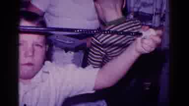 Minnesota USA (1968): Eager Children Anticipating To Play With A Box Full Of Toys