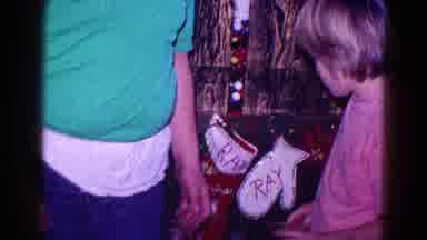 Minnesota USA (1968): Two Children In Front Of A Fireplace With Christmas