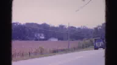 Wauconda Illinois USA (1968): Dump Truck Driving Down Street In A Rural Area With
