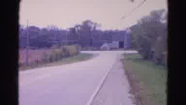 Wauconda Illinois USA (1968): Warehouse On A Quiet Street With Trees And A Car
