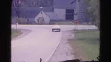 Wauconda Illinois USA (1968): Intersection Car Passing Still Road