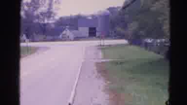 Wauconda Illinois USA (1968): Car Drives Down The Street Then The Car Return And