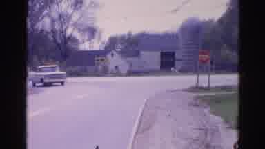 Wauconda Illinois USA (1968): Man Drives Down The Road In A White Pick Up Truck