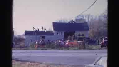 Wauconda Illinois USA (1968): People On Top Of House Preparing For An Attack