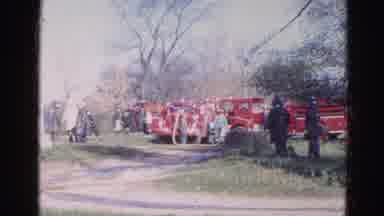 Wauconda Illinois USA (1968): Fire Trucks Are Parked In Front Of A Building With
