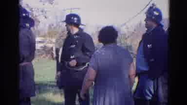 Wauconda Illinois USA (1968): Law Enforcement Smokes While Helping Citizen
