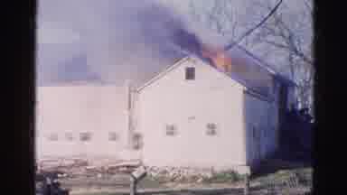 WAUCONDA ILLINOIS USA-1968: A White Barn Burns As Firefighters Respond