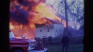Wauconda Illinois USA (1968): Large Flames Shooting Out Of A Building That's On