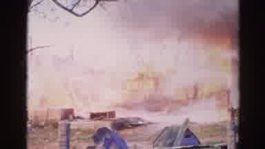 Wauconda Illinois USA (1968): Fire And Smoke Burn In An Area With Wood While Water