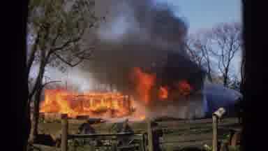 Wauconda Illinois USA (1968): Burning House Fire Doused By Firemen In A Village