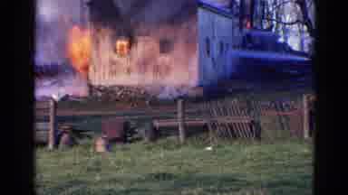 Wauconda Illinois USA (1968): Place Burning Down While Someone Passes By