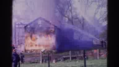 Wauconda Illinois USA (1968): Fireman Trying To Put Out The Fire Of A Burning
