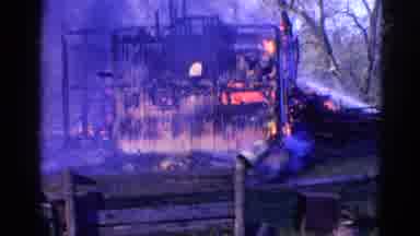 Wauconda Illinois USA (1968): A Building On Fire And People Trying To Stop It