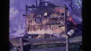 Wauconda Illinois USA (1968): Face Of A Home On Fire With Water Spraying From The
