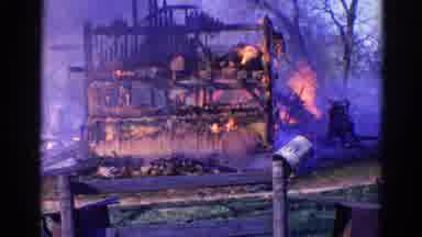 Wauconda Illinois USA (1968): There Is A Burning Structure And Two Men Are Trying