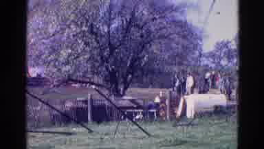 Wauconda Illinois USA (1968): People Removing Clothes From Clothesline On A Clear