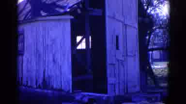 Wauconda Illinois USA (1968): View Of Person Sitting On Tractor Tire And A White
