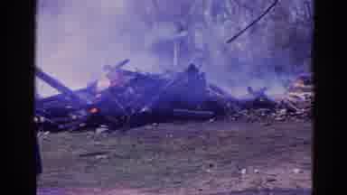 Wauconda Illinois USA (1968): A Fire Is Burning And A Truck Is Driving Down The