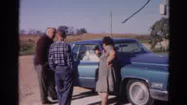 Wauconda Illinois USA (1968): People Stand Outside Of A Car Talking To Its