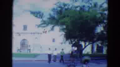 Diller Nebraska (1969): Three People Crossing A Street While Many Other People