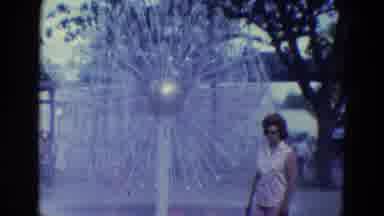 Diller Nebraska (1969): A Woman Standing By A Large Fountain