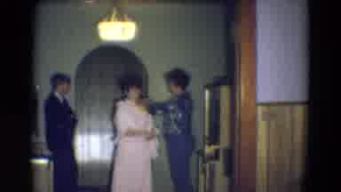 Diller Nebraska (1969): Woman Helps Fix Another's Dress As Man Waits Impatiently